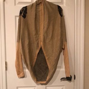 Brown sweater with cheetah on the back.